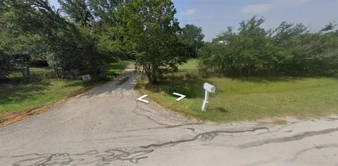 a lake view with a trees in the background