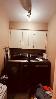 a backyard of a house with table and chairs