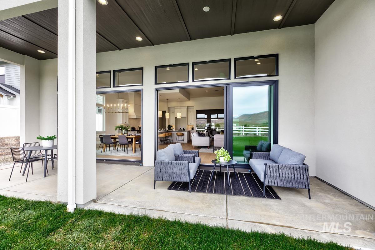 13758 North Ruffed Grouse Way Boise, ID 83714 - Photo 32 of 45 View of patio with an outdoor living / dining area