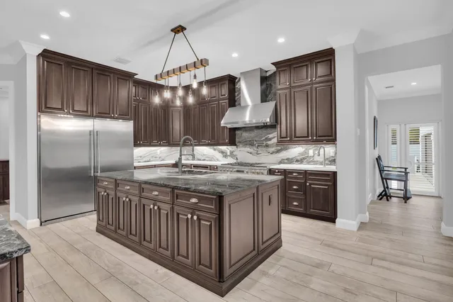 a view of a kitchen with furniture and a flat screen tv