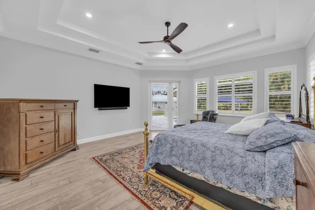 a bedroom with a bed and a rug