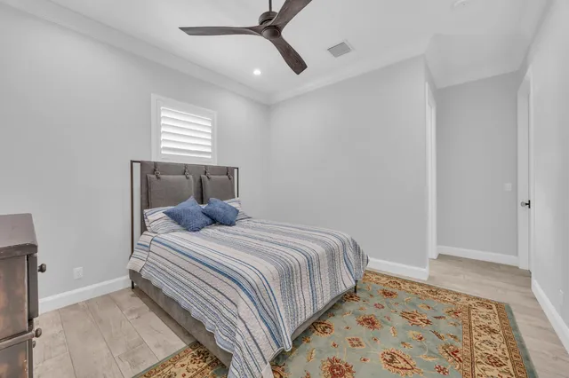 a bedroom with a bed and a television