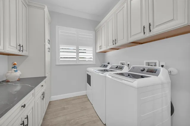 a swimming pool with outdoor seating and garden