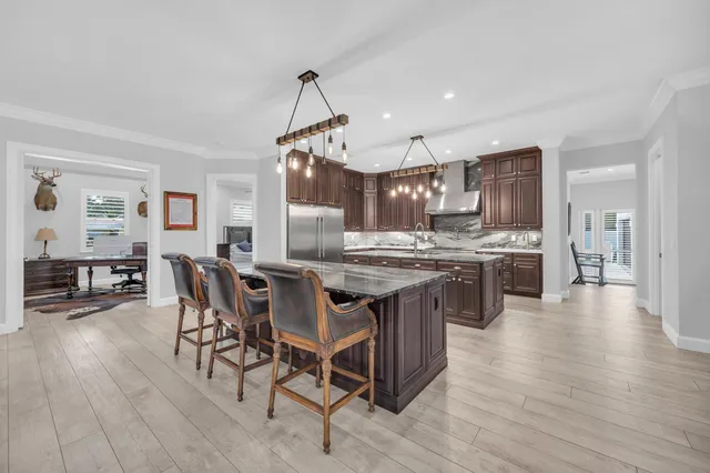 a kitchen with granite countertop a stove and a sink