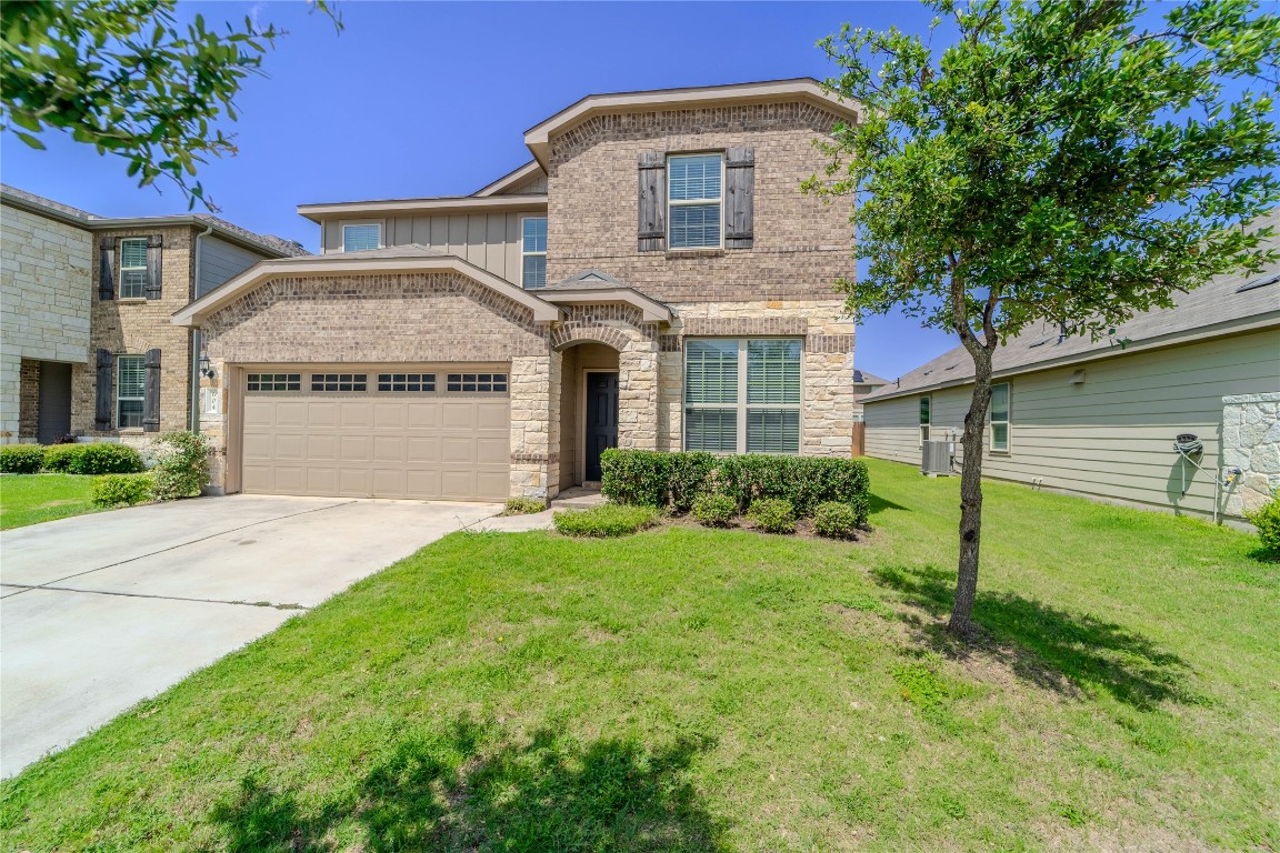 a front view of a house with a yard