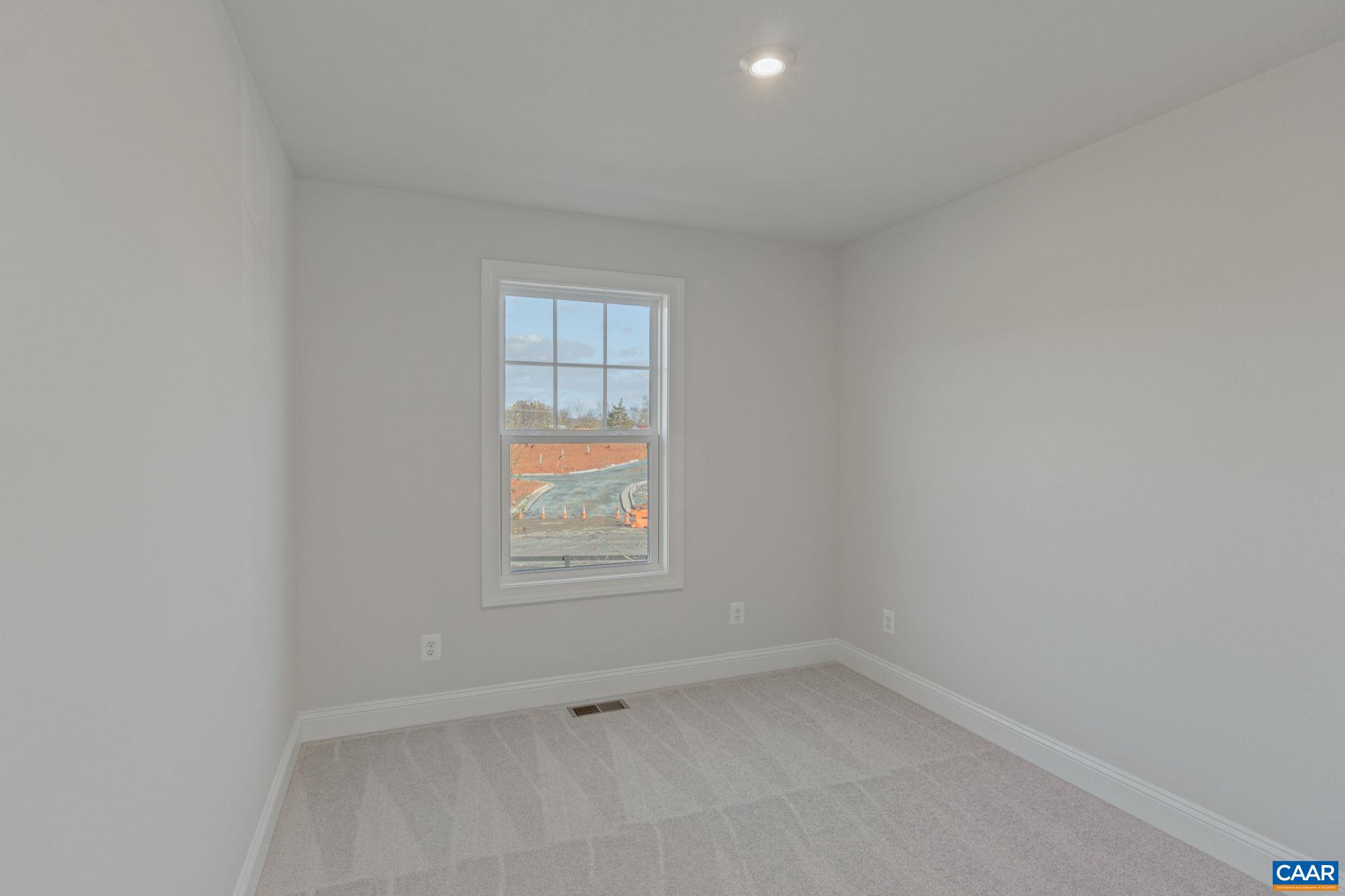 2201 Woodburn Road Charlottesville, VA 22901 - Photo 28 of 43 an empty room with a window