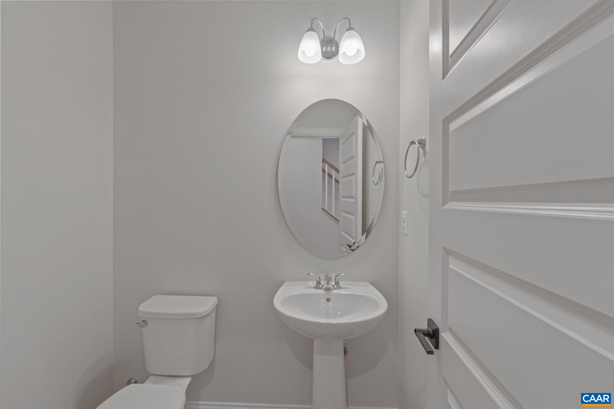 2201 Woodburn Road Charlottesville, VA 22901 - Photo 34 of 43 a bathroom with a sink a toilet and a mirror