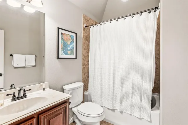 an aerial view of residential building and lake