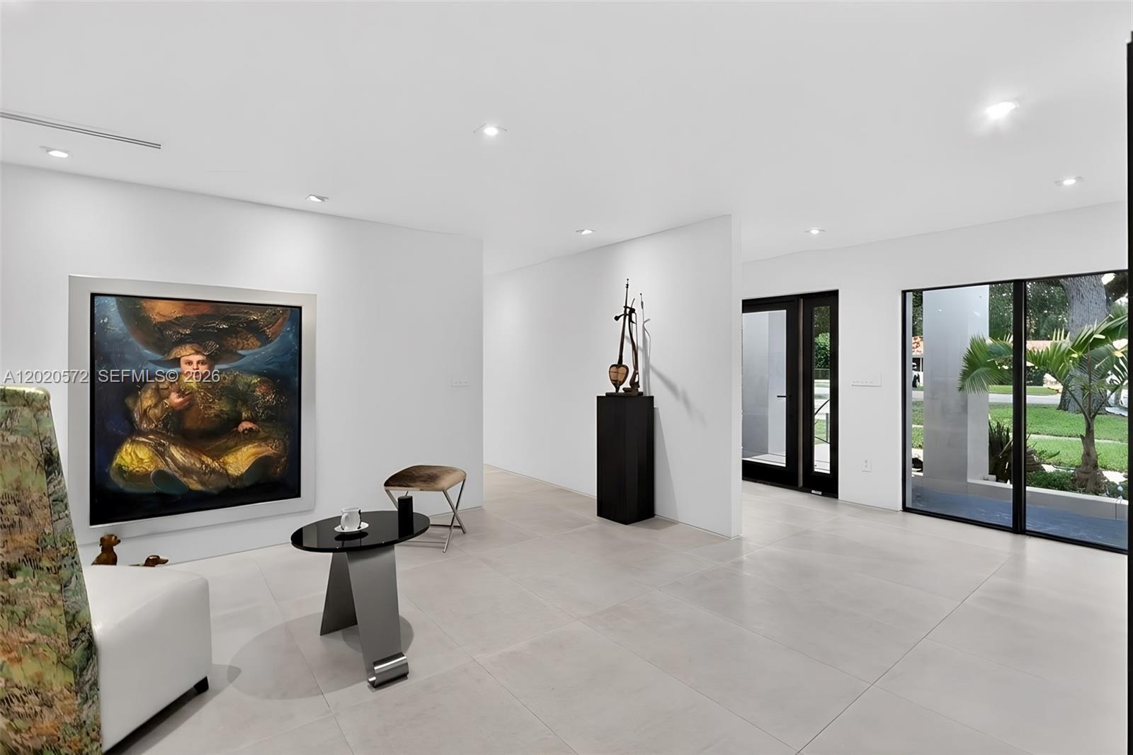 439 Hardee Road Coral Gables, FL 33146 - Photo 5 of 35 a view of a livingroom with furniture and floor to ceiling window