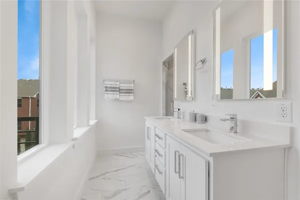 a bathroom with a sink a vanity and a mirror