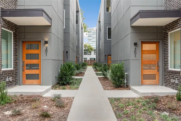 a view of a building with potted plants