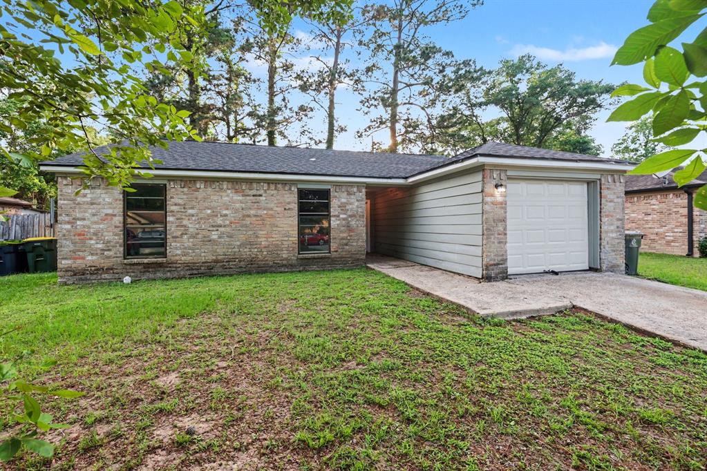 1321 North 7th Street Conroe, TX 77301 - Photo 2 of 17 front view of house with a yard