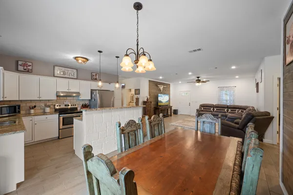 a dining room with furniture and window