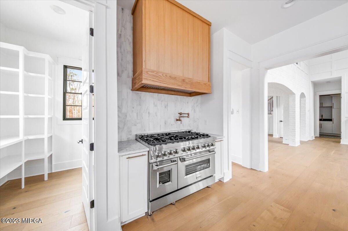 110 Birch Circle Forsyth, GA 31029 - Photo 14 of 44 a kitchen with stainless steel appliances white cabinets and a stove