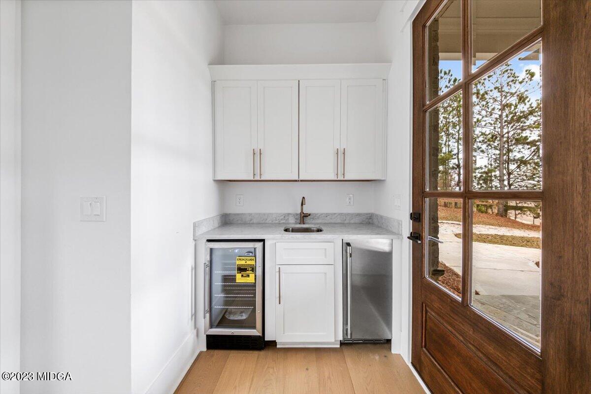 110 Birch Circle Forsyth, GA 31029 - Photo 15 of 44 a kitchen with a stove and a refrigerator
