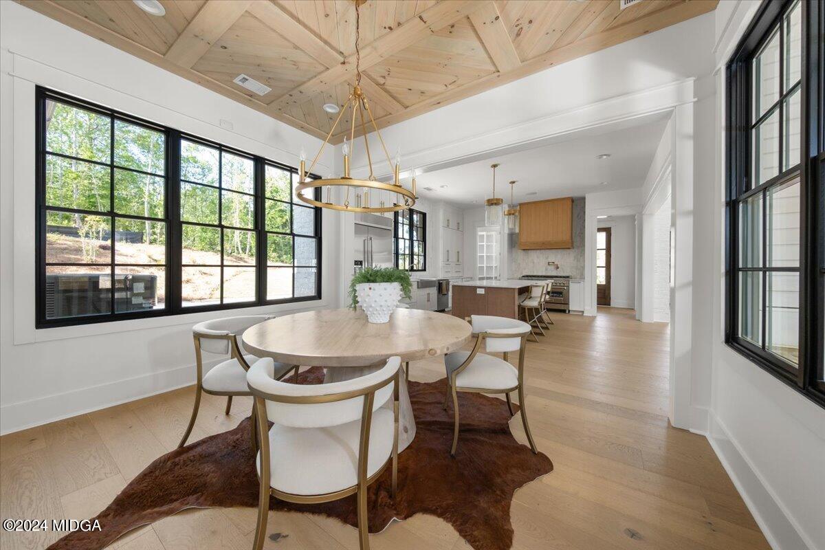 110 Birch Circle Forsyth, GA 31029 - Photo 16 of 44 a dining room with furniture a chandelier and window