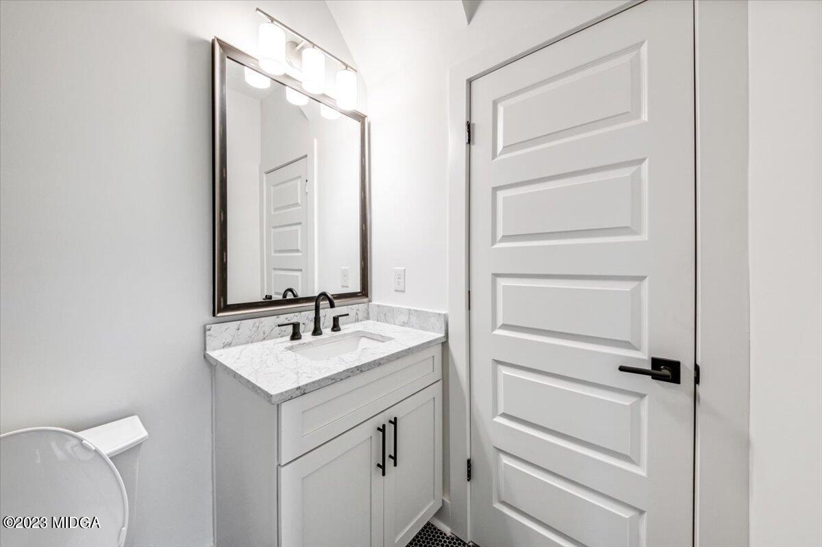 110 Birch Circle Forsyth, GA 31029 - Photo 29 of 44 a bathroom with a sink and a mirror