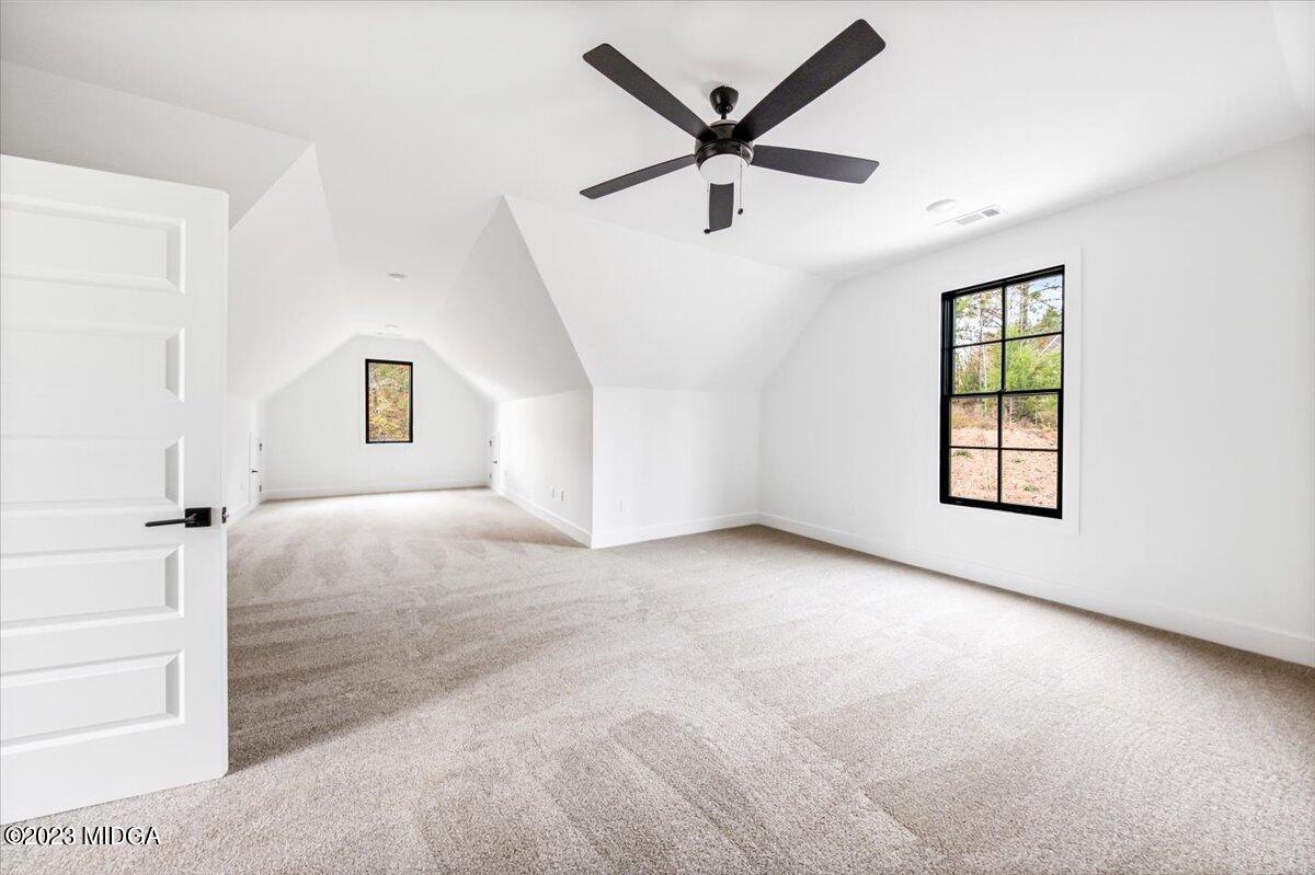 110 Birch Circle Forsyth, GA 31029 - Photo 34 of 44 a view of a livingroom with a ceiling fan and window