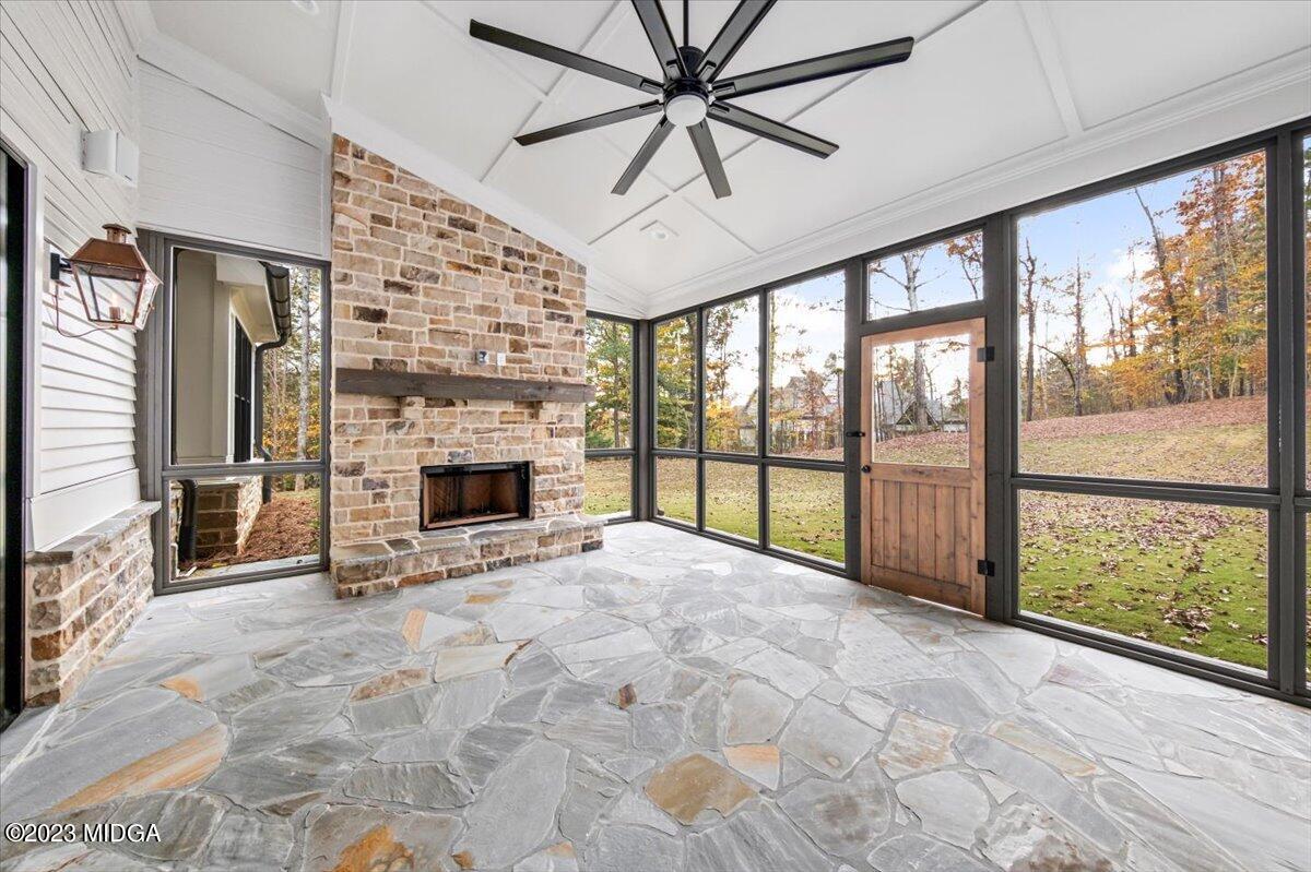 110 Birch Circle Forsyth, GA 31029 - Photo 37 of 44 a view of an empty room with a fireplace and a large window