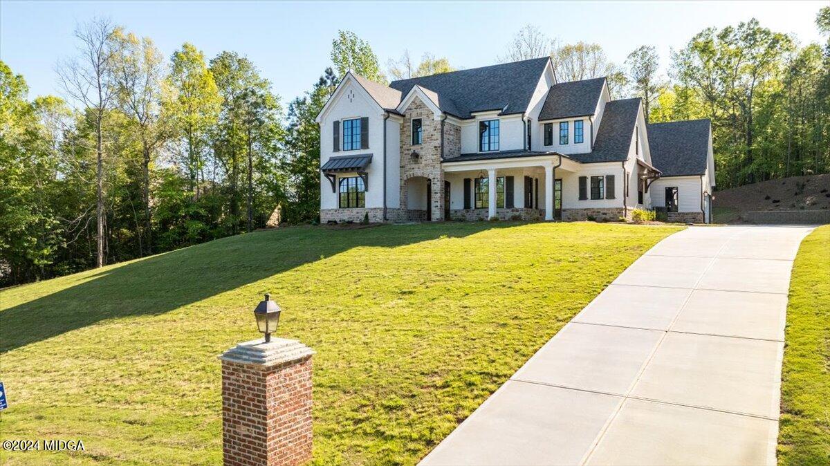 110 Birch Circle Forsyth, GA 31029 - Photo 41 of 44 a front view of a house with garden