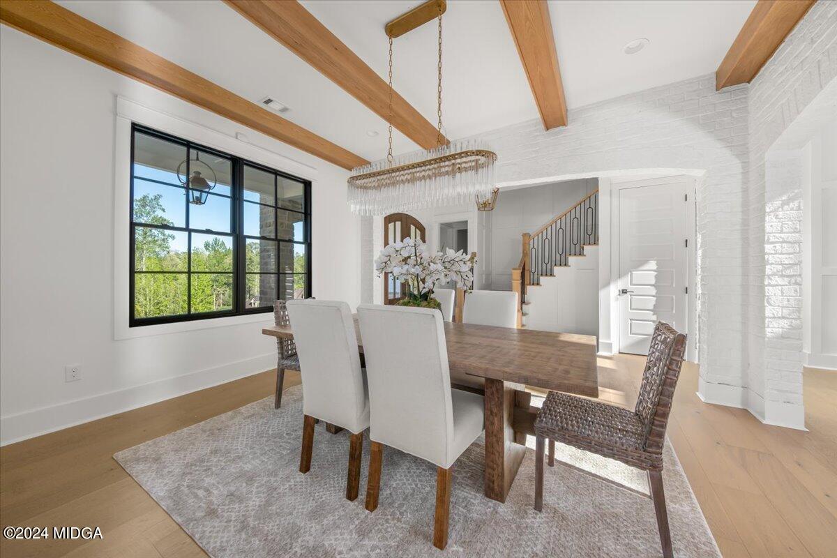 110 Birch Circle Forsyth, GA 31029 - Photo 5 of 44 a view of a dining room with furniture window and wooden floor