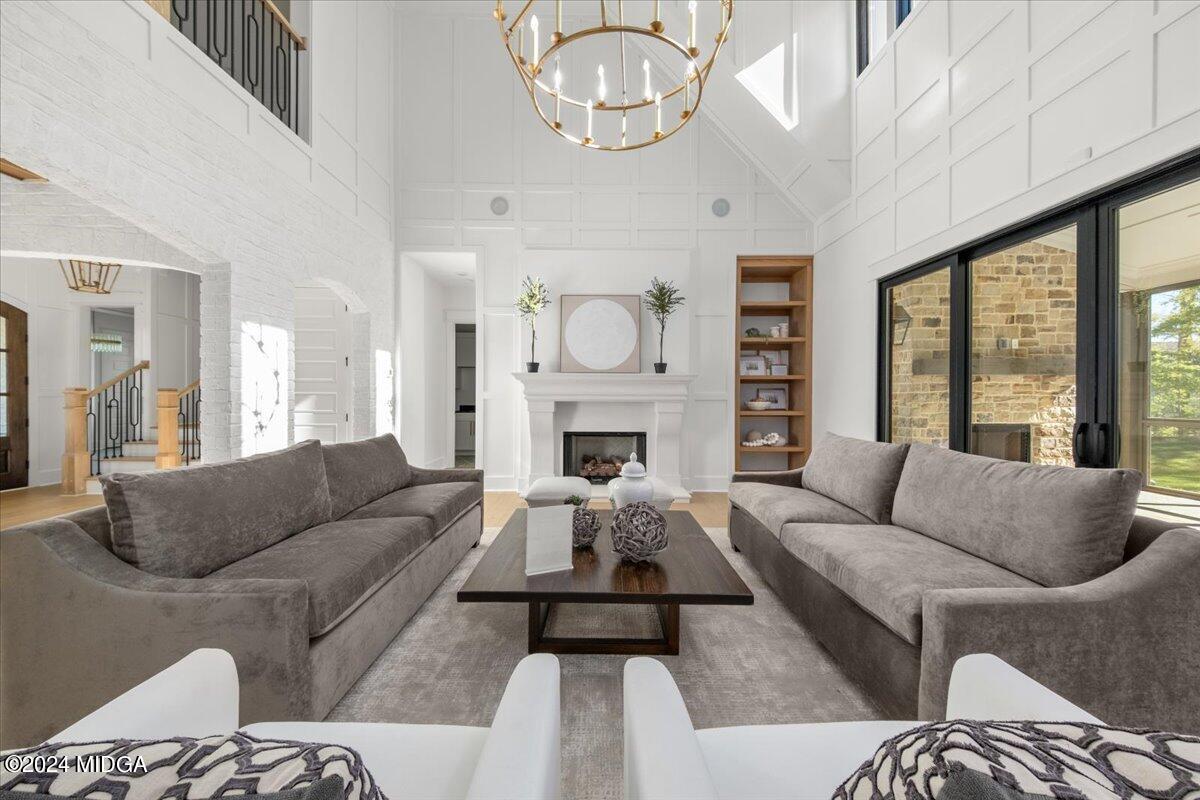 110 Birch Circle Forsyth, GA 31029 - Photo 7 of 44 a living room with furniture fireplace and a large window