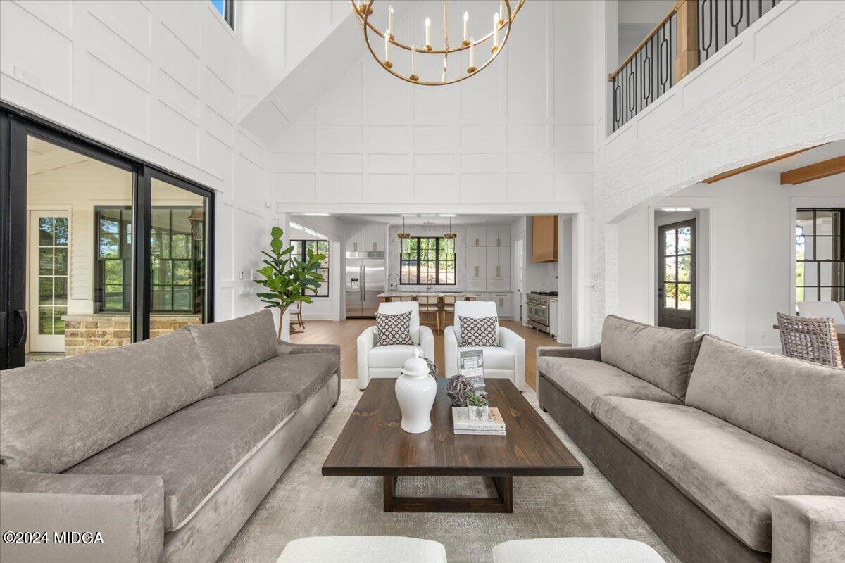 110 Birch Circle Forsyth, GA 31029 - Photo 8 of 44 a living room with furniture or couch and a large window