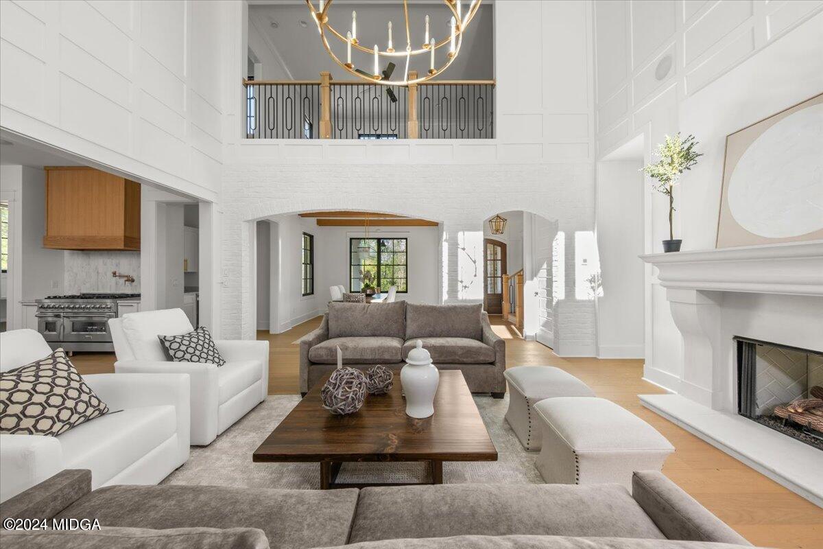 110 Birch Circle Forsyth, GA 31029 - Photo 9 of 44 a living room with furniture a fireplace and a flat screen tv