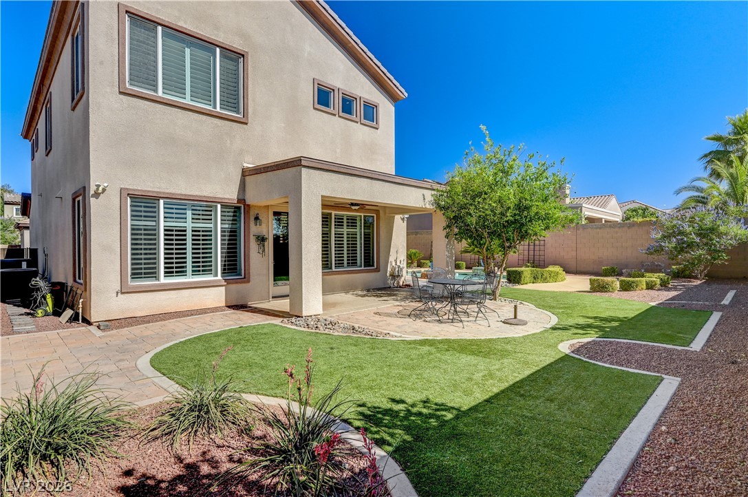2793 Rosenhearty Drive Henderson, NV 89044 - Photo 55 of 85 This residence features a meticulously landscaped backyard with a patio for leisure and artificial turf for effortless upkeep.