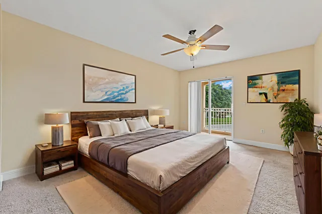 a bedroom with a large bed and a window