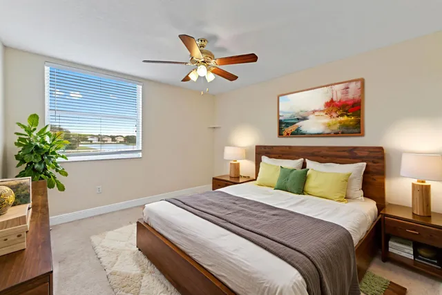 a bedroom with bed and wooden floor