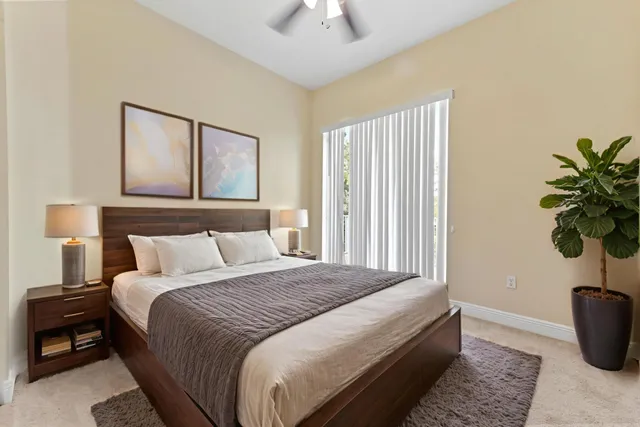 a bedroom with bed and window