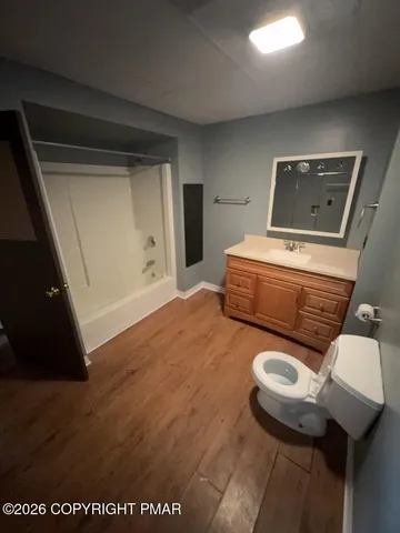 a bathroom with a toilet and a sink