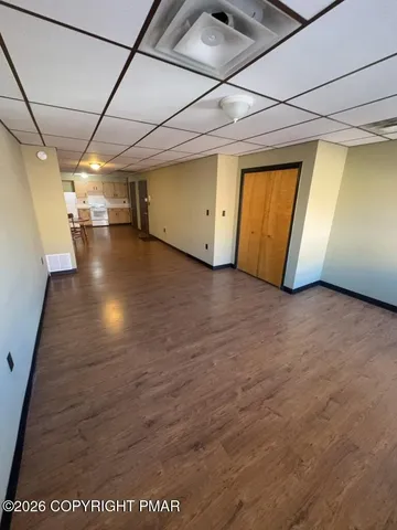 a view of a room with wooden walls