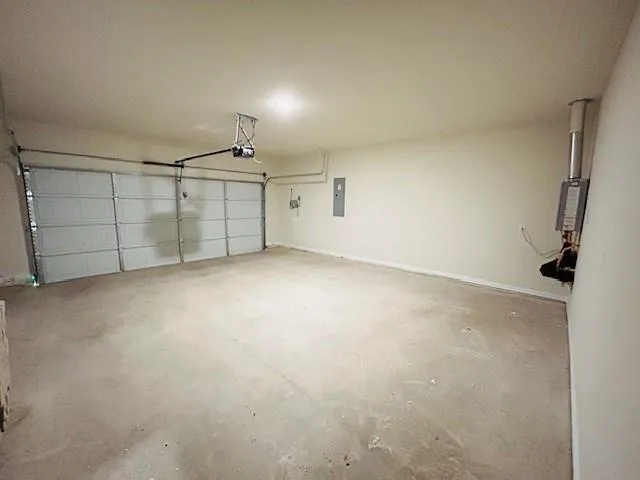 an empty room with projector & cabinets