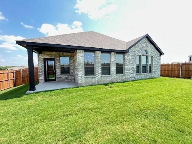 a view of a house with a yard and porch