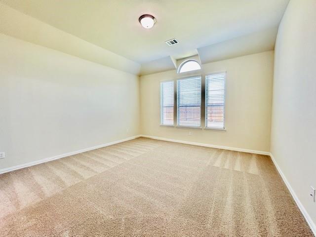 4219 Hummingbird Drive Sherman, TX 75092 - Photo 8 of 16 an empty room with windows and chandelier fan