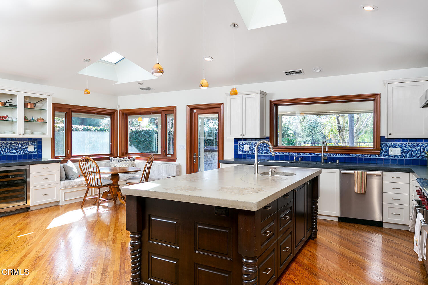 1563 Meadowbrook Road Altadena, CA 91001 - Photo 12 of 38 a kitchen with a stove a sink dishwasher and a dining table with the kitchen view