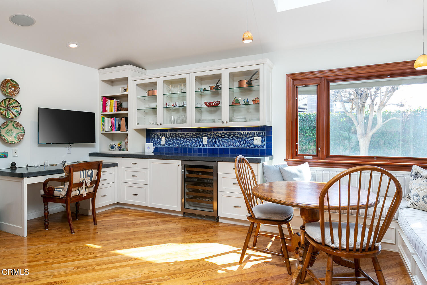 1563 Meadowbrook Road Altadena, CA 91001 - Photo 17 of 38 a dining room with furniture a fireplace and wooden floor