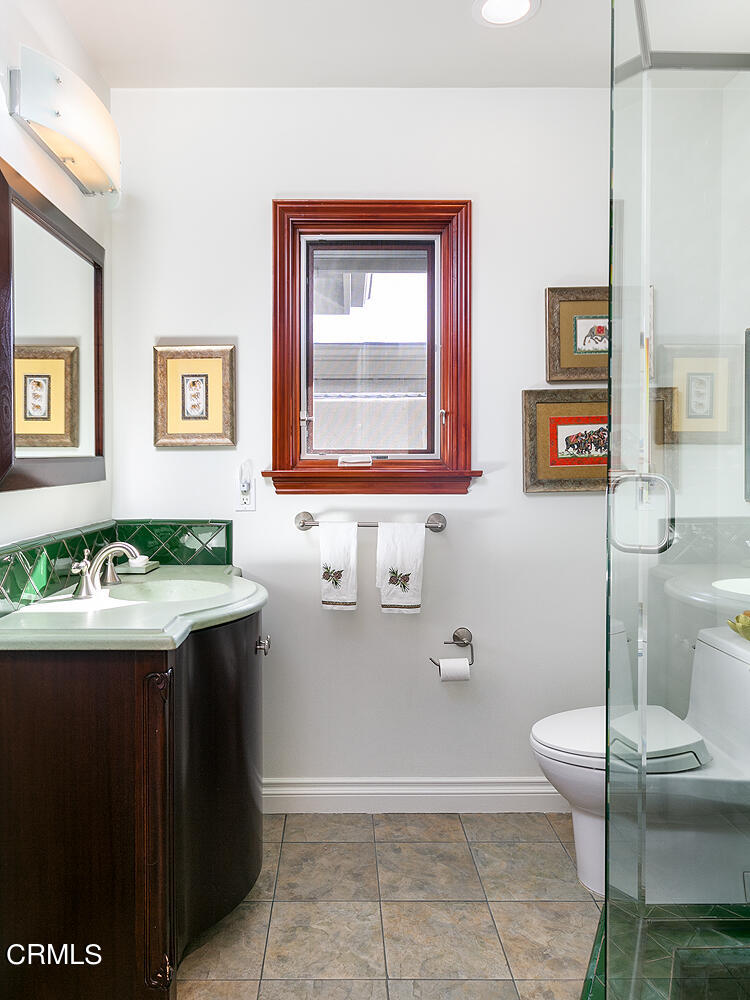 1563 Meadowbrook Road Altadena, CA 91001 - Photo 18 of 38 a view of a bathroom with a sink and mirror