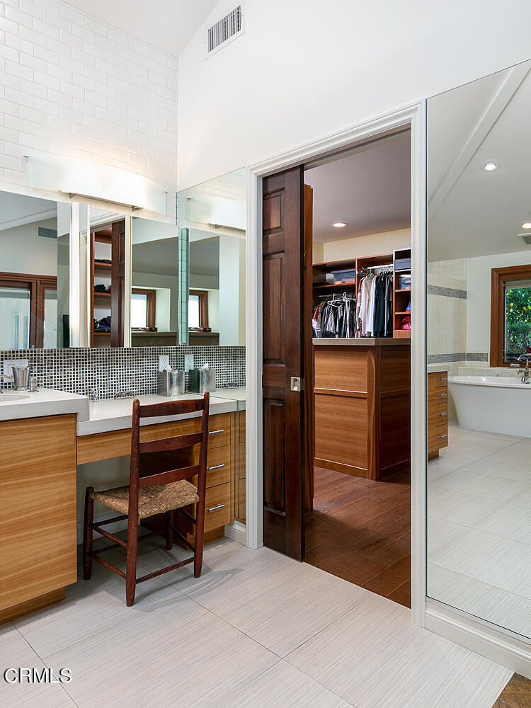 1563 Meadowbrook Road Altadena, CA 91001 - Photo 22 of 38 a spacious bathroom with a granite countertop sink and a mirror