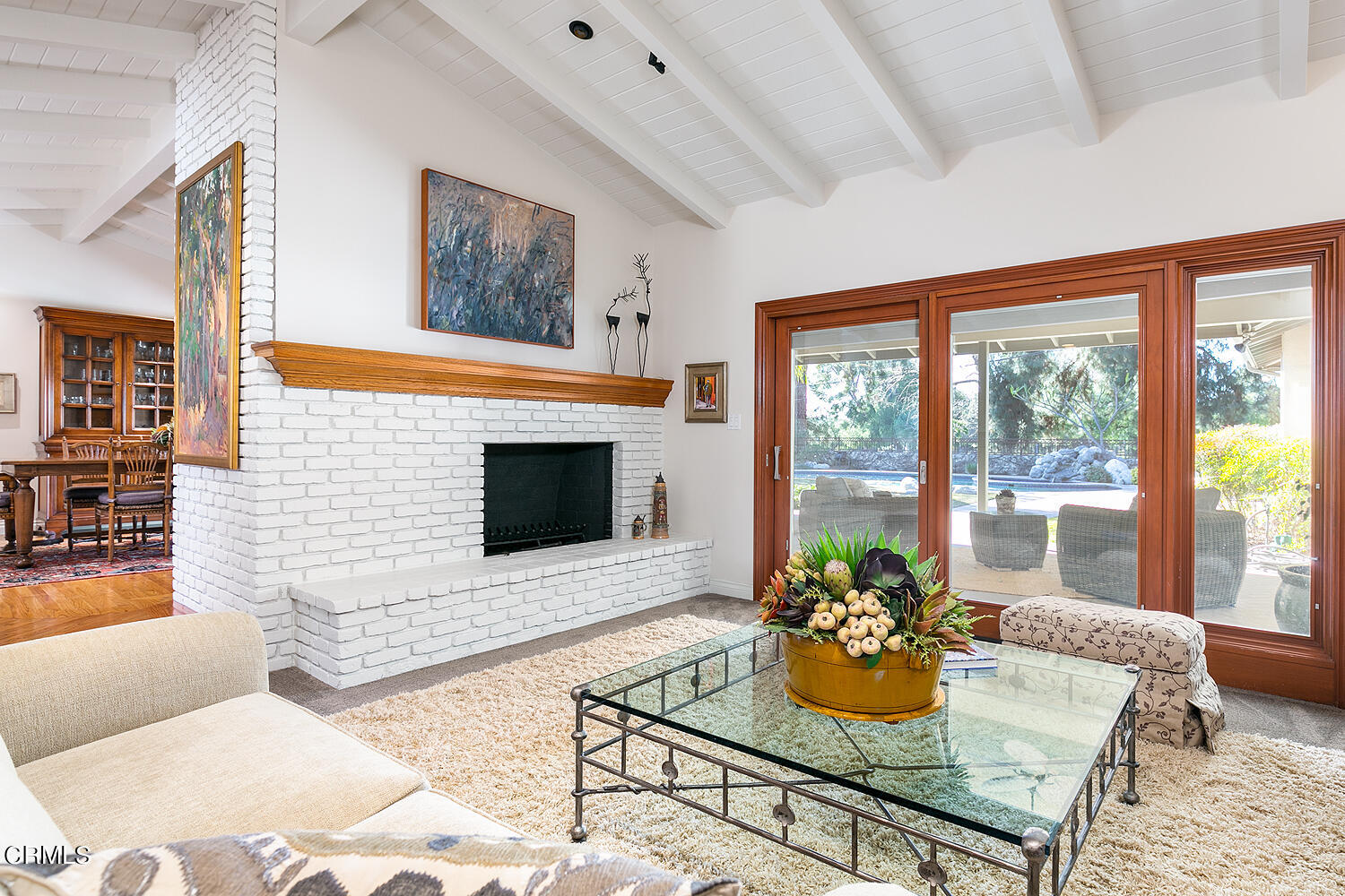 1563 Meadowbrook Road Altadena, CA 91001 - Photo 8 of 38 a living room with furniture a flat screen tv and a fireplace