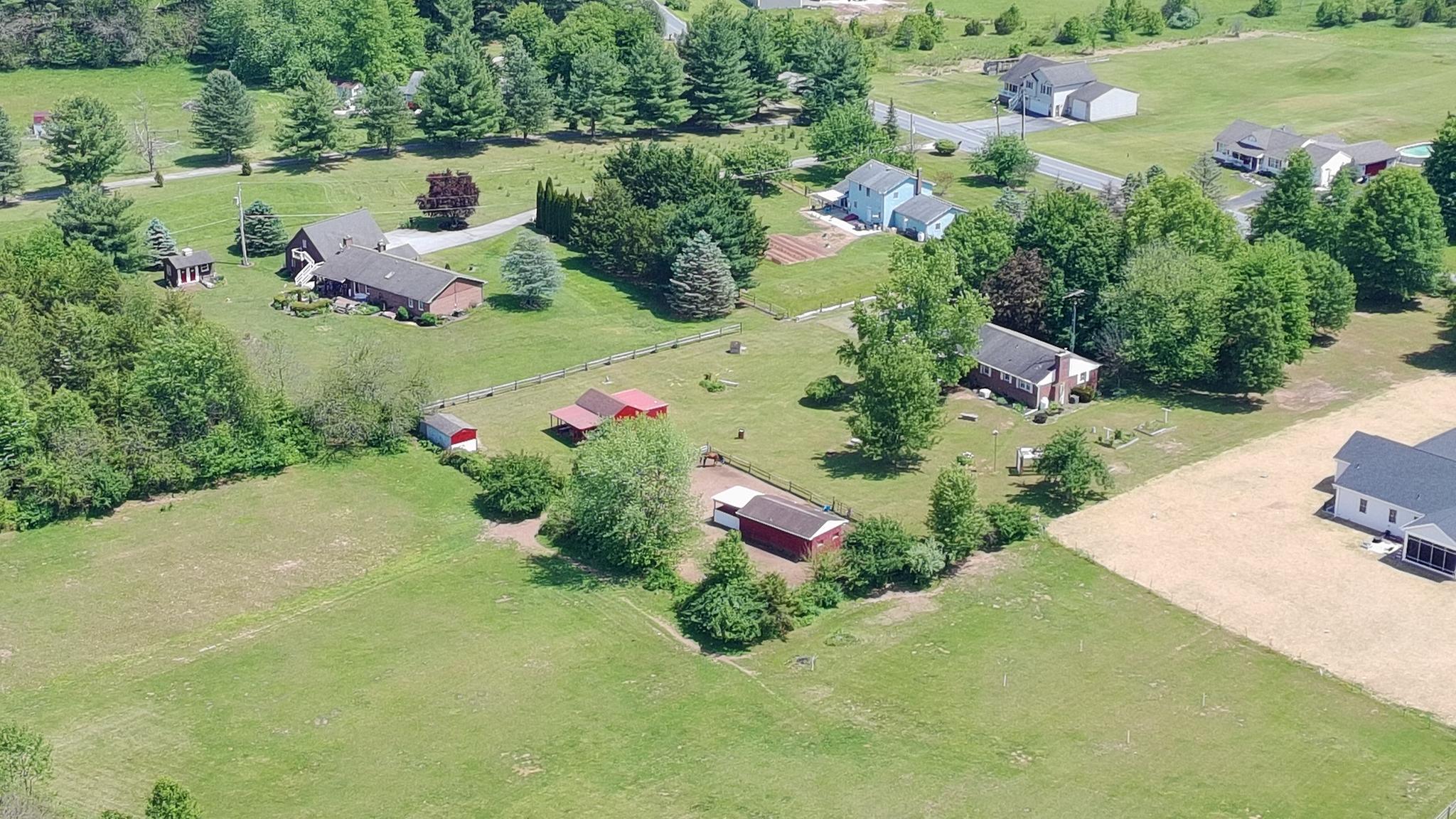 2226 Harney Road Littlestown, PA 17340 - Photo 38 of 40 an aerial view of green landscape with trees houses and lake view