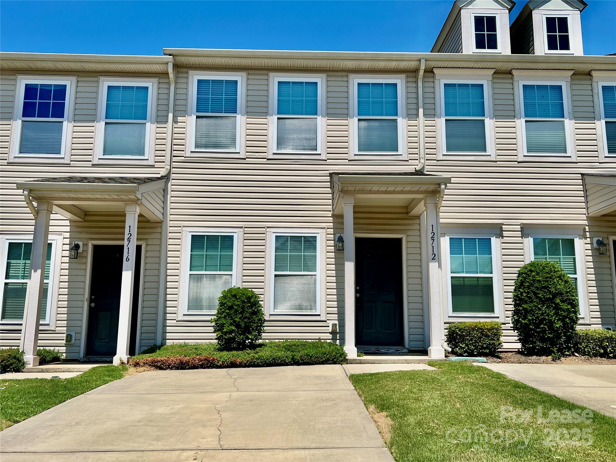 12712 Persimmon Tree Drive Charlotte, NC 28273 - Photo 1 of 9 a front view of a house with garden