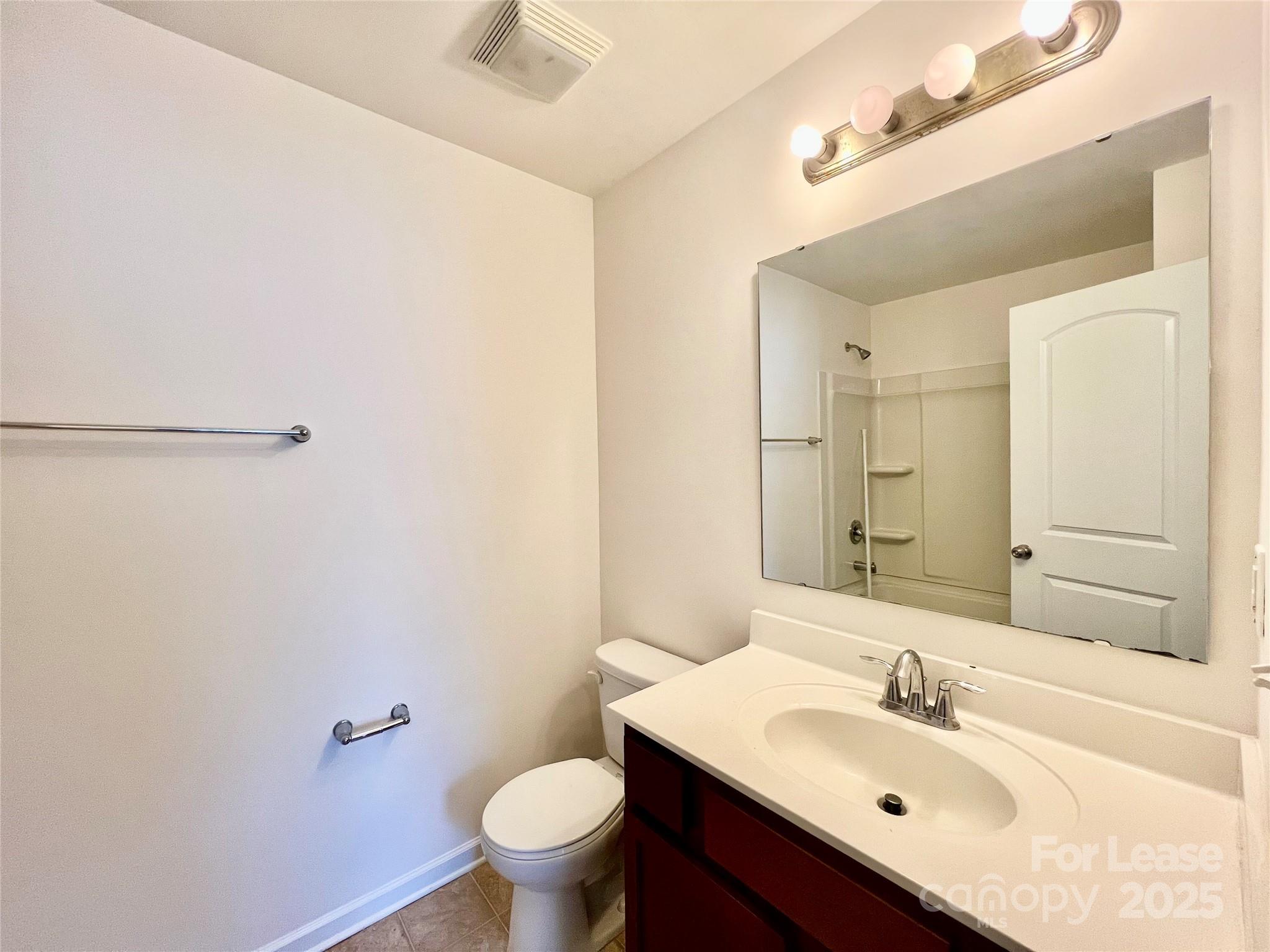 12712 Persimmon Tree Drive Charlotte, NC 28273 - Photo 2 of 9 a bathroom with a sink toilet and shower