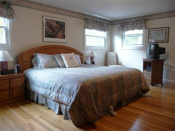 40 Harold Street Sharon, MA 02067 - Photo 11 of 22 a bedroom with a bed and a lamp on dresser