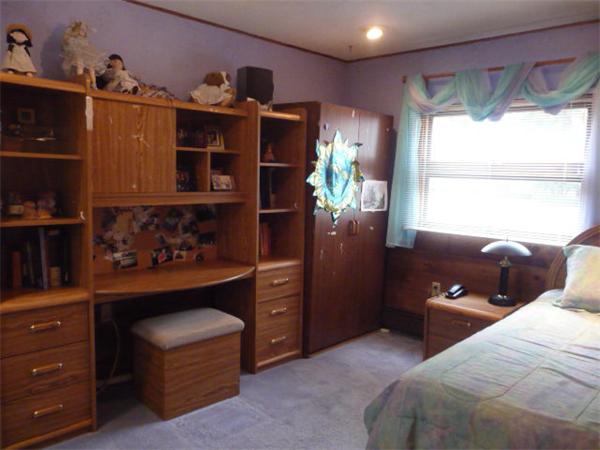 40 Harold Street Sharon, MA 02067 - Photo 15 of 22 a bedroom with a bed and a dresser