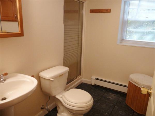 40 Harold Street Sharon, MA 02067 - Photo 18 of 22 a white toilet sitting next to a bathroom sink