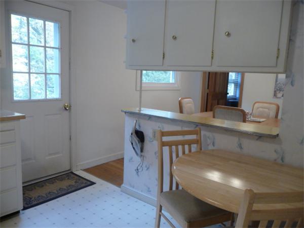 40 Harold Street Sharon, MA 02067 - Photo 10 of 22 a kitchen with a table and chairs