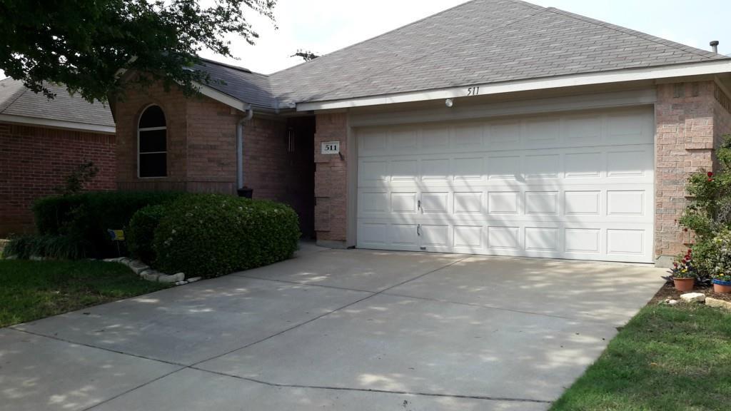 511 Horse Shoe Drive Euless, TX 76039 - Photo 1 of 1 a view of a house with a yard and garage